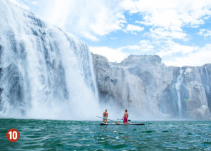 Wake boarders looking at waterfall